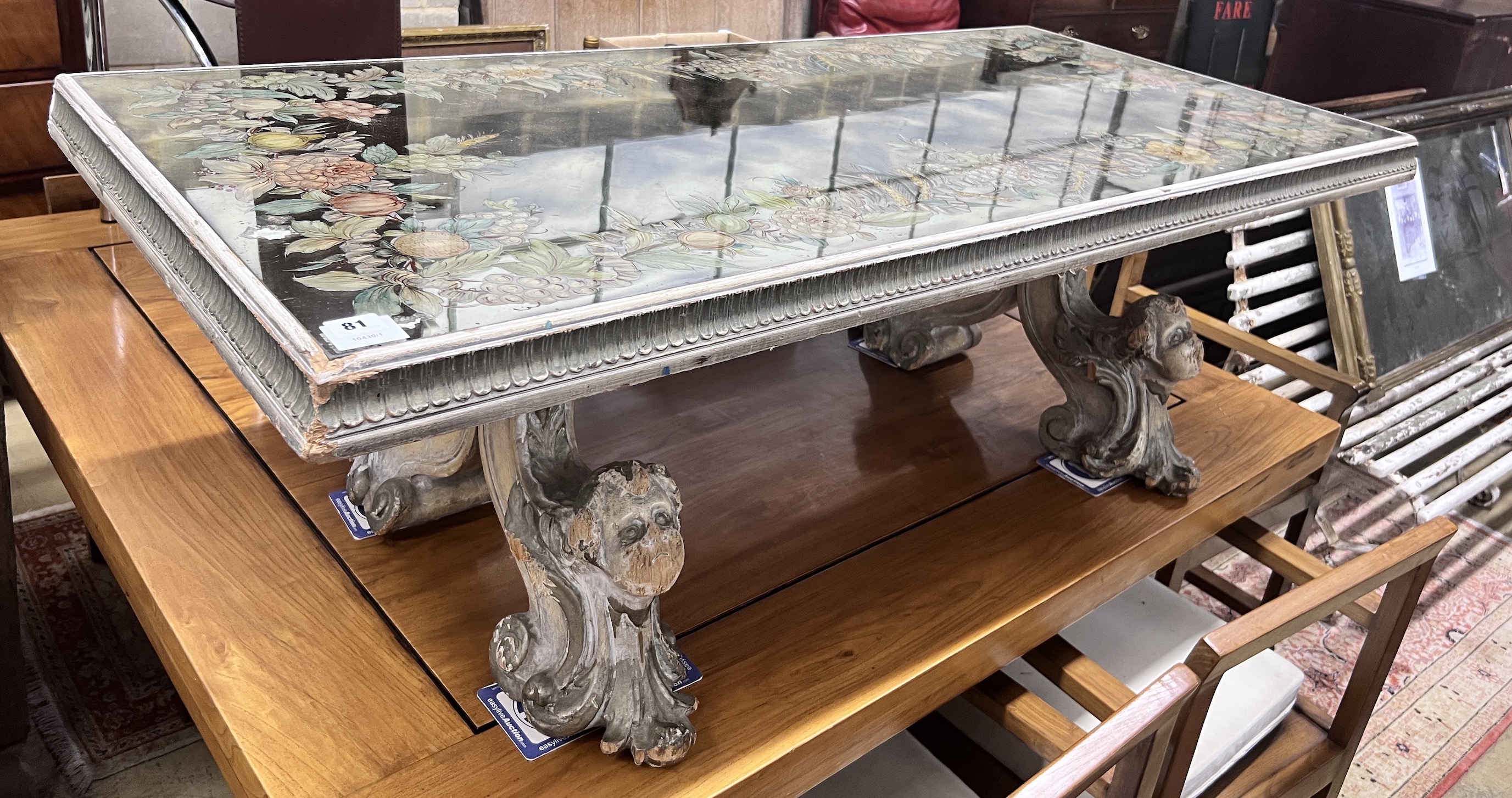 An Italian carved pine rectangular coffee table with painted mirrored top, width 141cm, depth 62cm, height 46cm